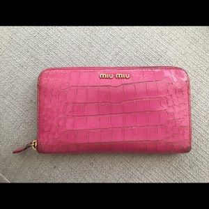 Miu Miu embossed continental wallet.